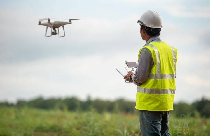 Construction Worker Flying a Drone