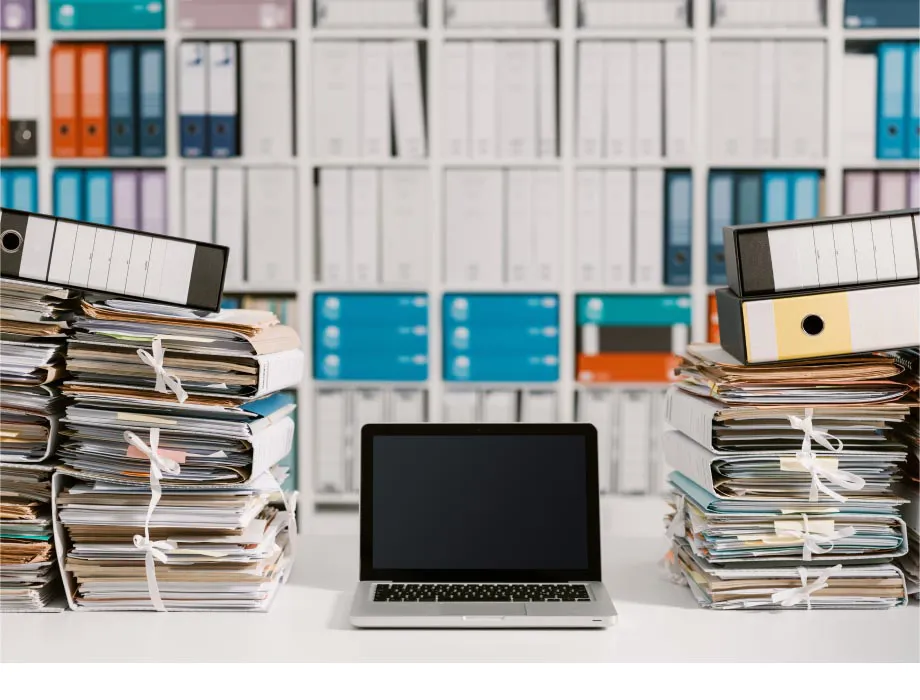 Laptop in front of books