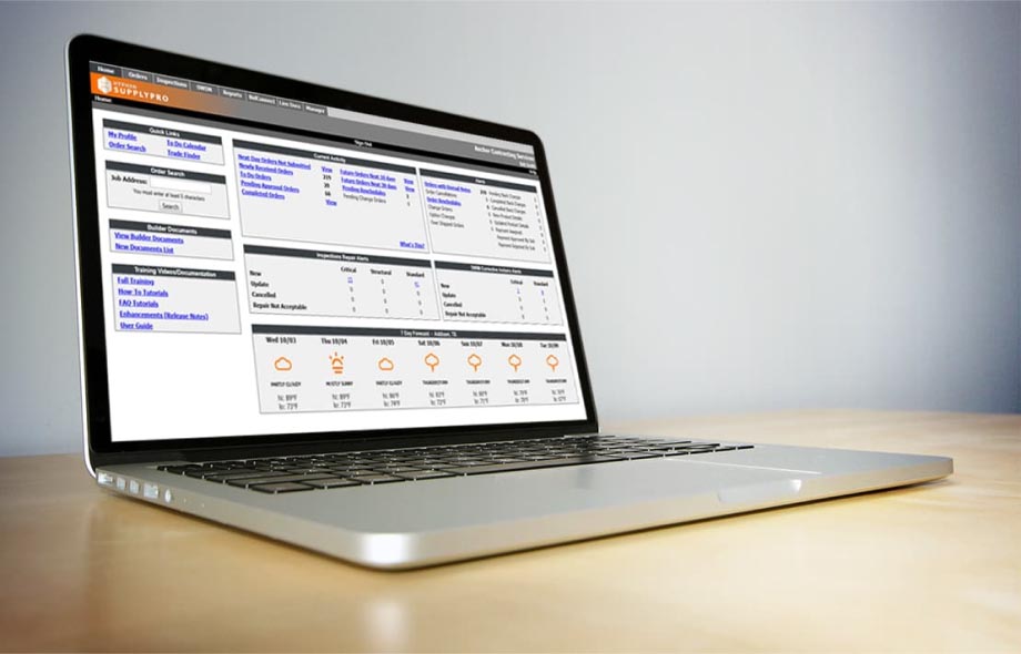 Laptop sitting on top of a table showing a Hyphen supply pro dashboard