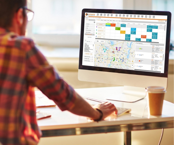 SupplyPro GM schedule screen on desktop with man at desk