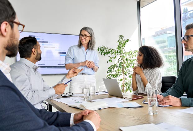 a meeting where one of the participants are asking the presenter a question