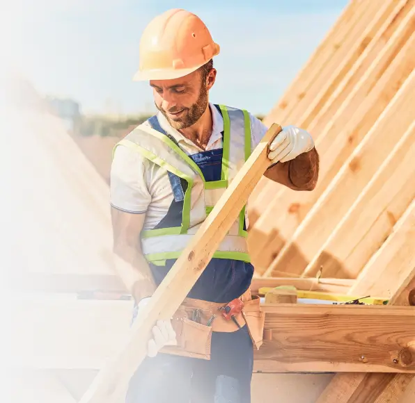 Construction worker working on structure of a new house