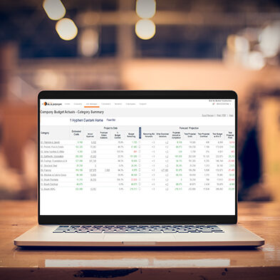 Laptop displaying Hyphen BuilderGM construction reporting