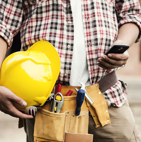 Construction worker checking their phone
